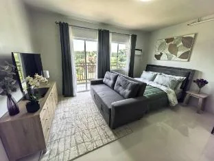 Stylish Condo Stay w/ Pool, Balcony & Near Airport