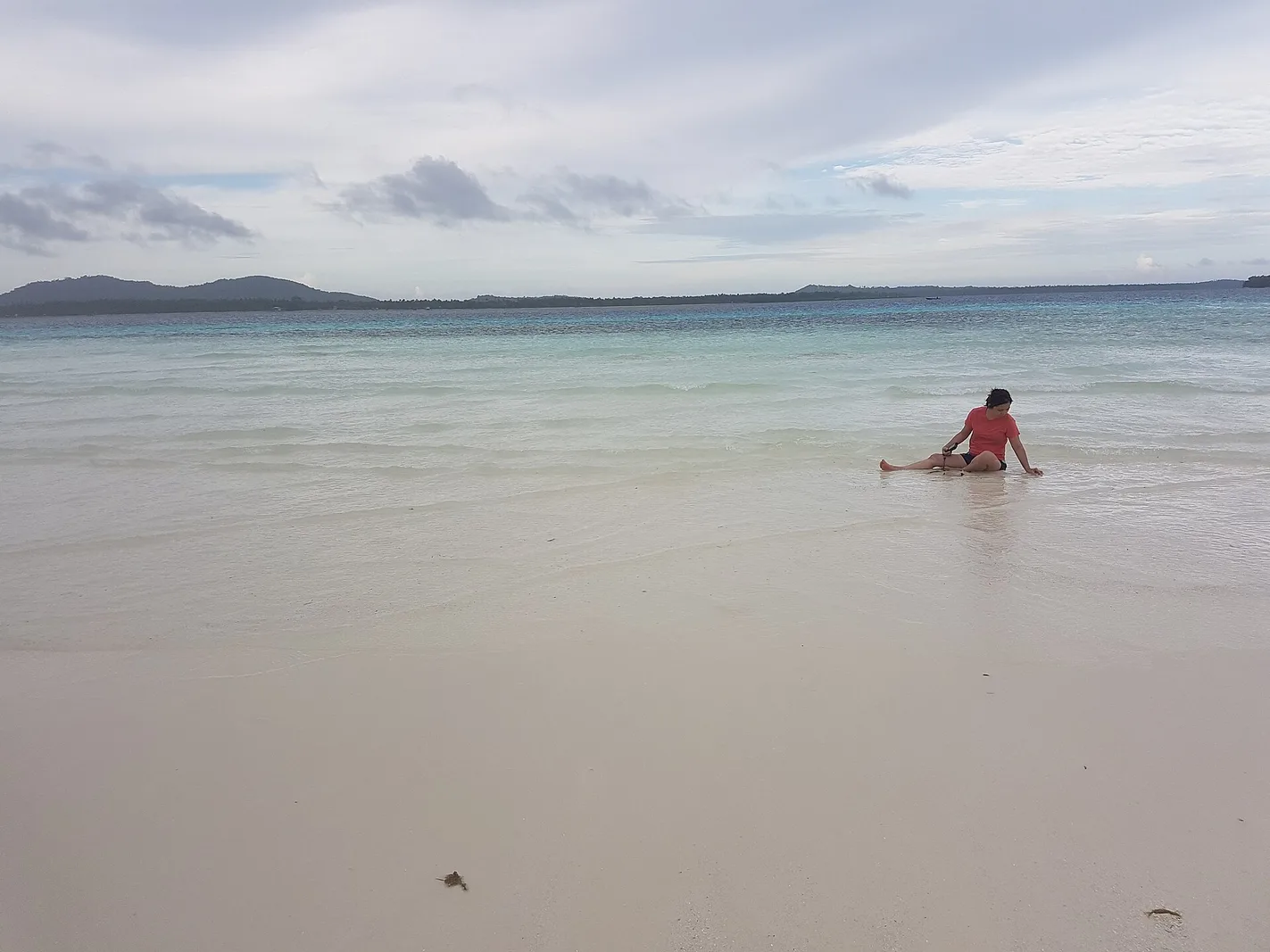 Clear water and coral near a Honda Bay island