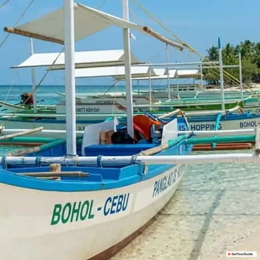 Snorkeler exploring the coral reef wall at Balicasag Island Marine Sanctuary in Bohol